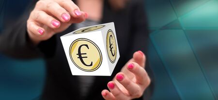 Euro concept between hands of a woman in backgroundの写真素材
