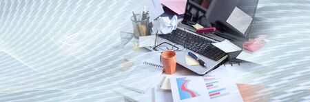 Messy and cluttered office desk; panoramic bannerの写真素材