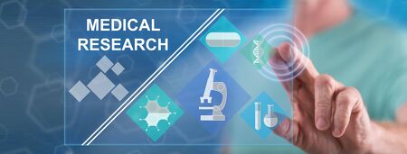Man touching a medical research concept on a touch screen with his fingerの写真素材
