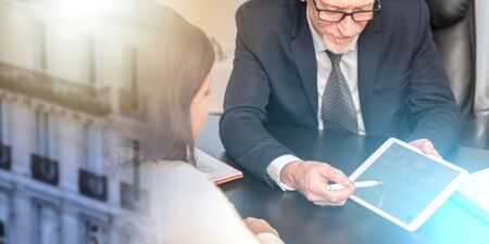 Consultant advising young woman at office; multiple exposure