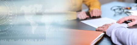 Situation of business negotiation between businesswoman and businessman; panoramic bannerの写真素材