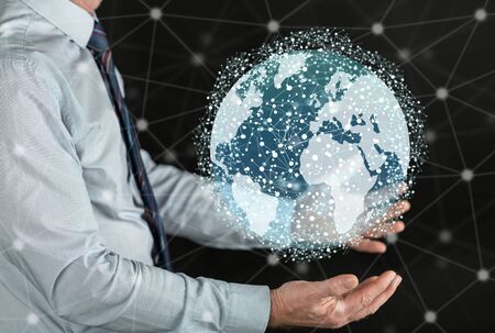 Global network concept above the hands of a man