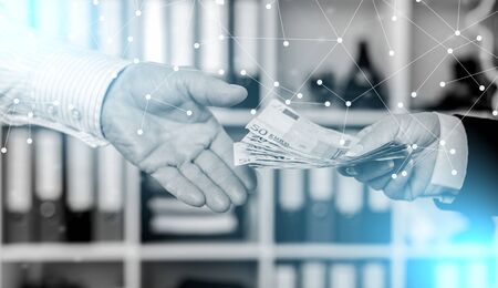 Hands exchanging cash; multiple exposureの写真素材