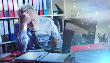 Tired businessman with headache in office, light effect; multiple exposure
