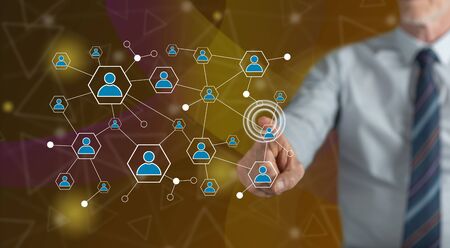 Man touching a social network on a touch screen with his fingerの写真素材