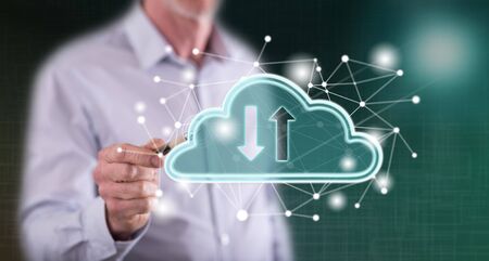 Man touching a cloud networking concept on a touch screen with a pen