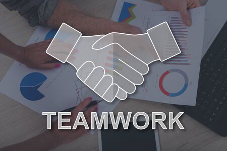 Teamwork concept illustrated by a picture on backgroundの写真素材