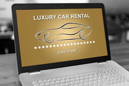 Laptop screen with luxury car rental conceptの写真素材