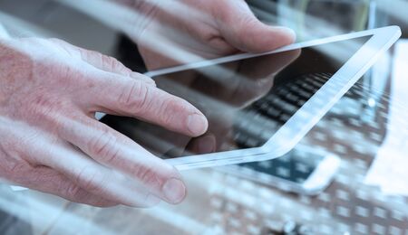 Finger touching digital tablet, light effectの写真素材