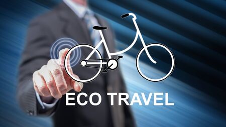 Man touching an eco travel concept on a touch screen with his fingersの写真素材