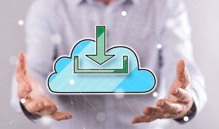 Cloud download concept above the hands of a man in background