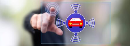 Man touching a smart car concept on a touch screen with his fingerの写真素材