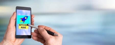 Smartphone screen displaying a bitcoin rise concept