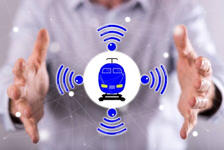Smart train concept between hands of a man in backgroundの写真素材