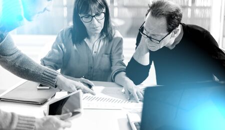 Business people working together in office; multiple exposure