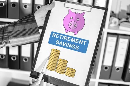 Woman holding a clipboard with retirement savings conceptの写真素材