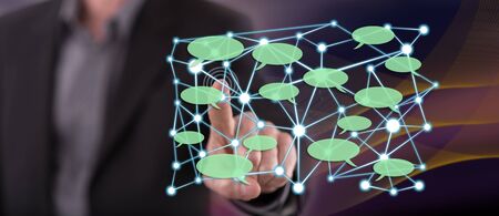 Man touching a social network concept on a touch screen with his finger