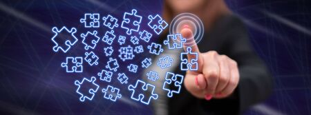 Woman touching a teamwork concept on a touch screen with her fingerの写真素材