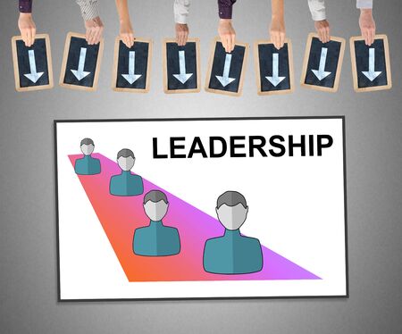 Hands holding writing slates with arrows pointing on leadership conceptの写真素材