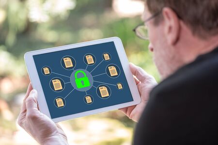 Tablet screen displaying a data protection conceptの写真素材
