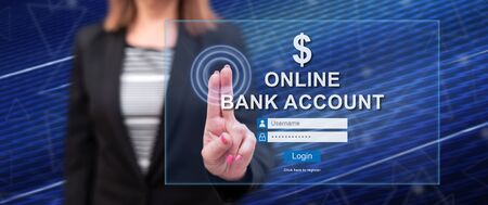 Woman touching an online bank account website on a touch screen with her fingersの写真素材