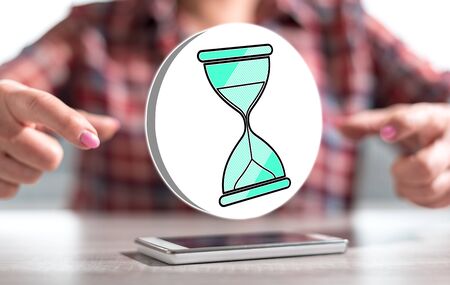 Smartphone with time management concept between hands of a woman in background