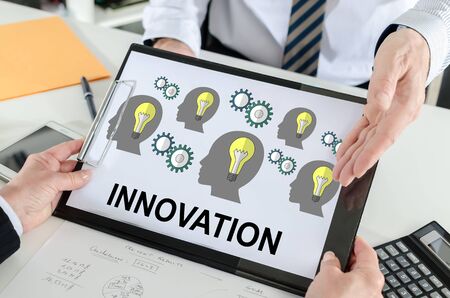 Innovation concept shown by a businessmanの写真素材