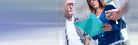 Coworkers having a business discussion in office; panoramic banner