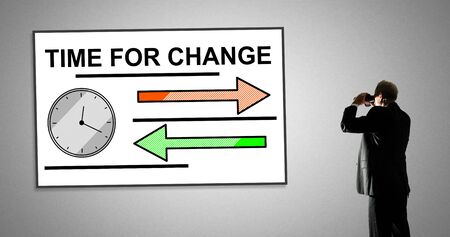 Man looking at time for change concept through binocularsの写真素材