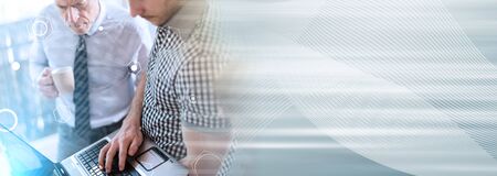 Business people in meeting working on laptop in office, overlaid with network, light effect; panoramic bannerの写真素材