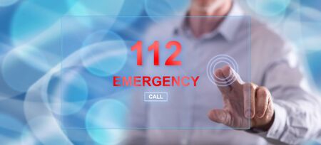 Man touching an emergency concept on a touch screen with his finger