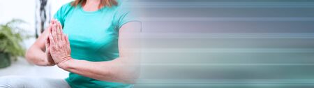 Woman doing yoga at home; panoramic bannerの写真素材