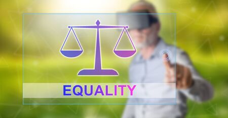 Man with vr headset touching an equality concept on a touch screen with his fingerの写真素材