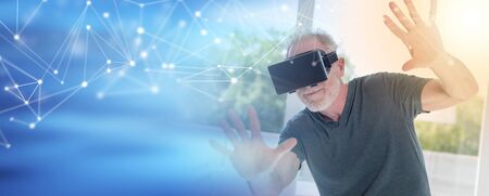 Senior man using a virtual reality headset; multiple exposure