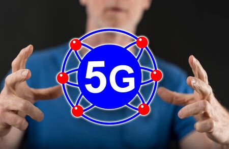 5g concept between hands of a man in background