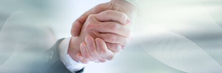 Business handshake, closeup; panoramic bannerの写真素材