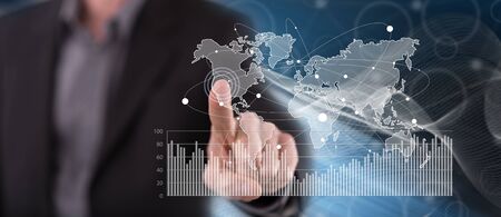Man touching a digital marketing statistics concept on a touch screen with his finger