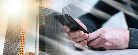 Male hands using his mobile phone; multiple exposure