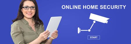 Woman using digital tablet with online home security concept on backgroundの写真素材