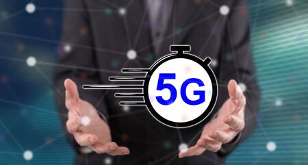 5g concept above the hands of a man in backgroundの写真素材