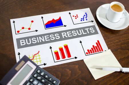 Business results concept on a paper placed on a deskの写真素材