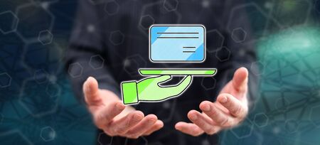 Credit card concept above the hands of a man in backgroundの写真素材