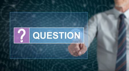 Man touching a question concept on a touch screen with his fingerの写真素材