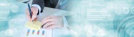 Businessman taking notes ; panoramic banner