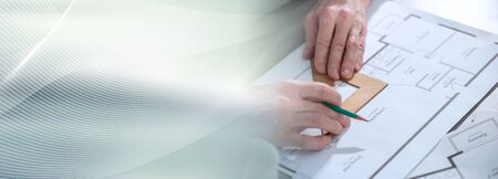 Architect working on a project and using a square; panoramic banner
