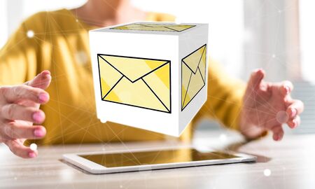 Digital tablet with message concept between hands of a woman in backgroundの写真素材