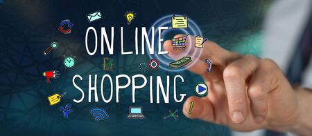 Man touching an online shopping concept on a touch screen with his fingerの写真素材