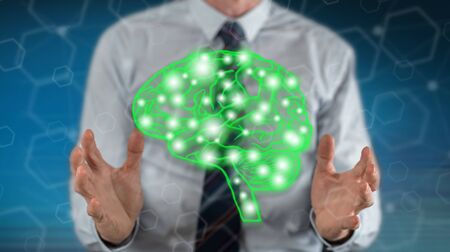 Artificial intelligence concept between hands of a man in backgroundの写真素材