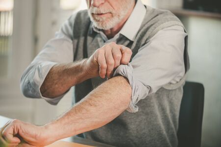 Motivated businessman rolling up his sleevesの写真素材