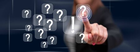 Woman touching a q&a concept on a touch screen with her finger
